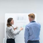 Risk Assessment - man in blue long sleeve shirt holding woman in gray sweater