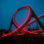 Feedback Loop - a roller coaster lit up at night with red lights